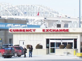 Customers leave the currency exchange recently at the Blue Water Bridge in Point Edward. Unionized workers at the currency exchange, and other departments at the bridge, are still waiting for the start of negotiations for a new contract. The union's previous contract ran out in November. (PAUL MORDEN, The Observer)