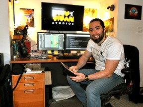 Local video game developer Jeff Evans, founder of Tiny Titan studios, in his home office Jan. 15, 2015. CHRIS MONTANINI\LONDONER\QMI AGENCY