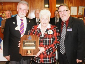 Mary Wolterbeek, who has a long involvement with minor hockey in Goderich was recently awarded the Melvin Jones Fellowship Award by the Goderich Lions Club. The award is considered the highest honour the club can give. Lions Club member Terry Worsell who introduced Mary, said she is the “surrogate mother of Young Canada Week”. Mary (centre) is joined by Lions Club District A-9 governor Hank Van Moorsel and Goderich Lions Club president Jim Crow (at right).