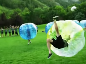 A screen grab from a YouTube video shows people playing bubble soccer.  A sport well established in Europe, the online videos are being used to entice participants in London?s first tournament.