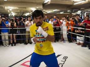 Manny Pacquiao is giving Floyd Mayweather until the end of January to sign an agreement to fight in May. (Tyrone Siu/Reuters/Files)