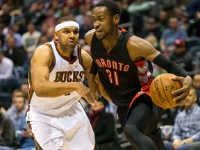 Raptors forward Terrence Ross (31) drives around Bucks guard Jared Dudley on Monday night in Milwaukee. (USA Today Sports)