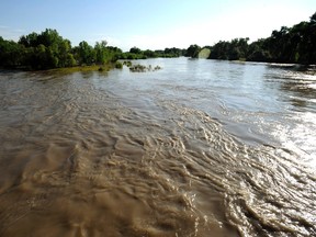 A view of the swollen Yellowstone River two miles down stream from the site of the oil spill in Laurel, Montana, July 5, 2011. 
REUTERS/John Warner