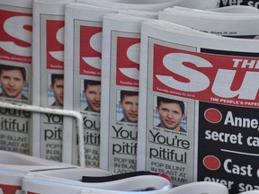 Copies of U.K.'s The Sun newspaper are seen on a newsstand outside a shop in central London Jan. 20, 2015.  REUTERS/Toby Melville