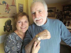 David Barnett, and his wife Cherie, are shown with a silver bracelet that was returned to him recently. Barnett left the bracelet behind after washing his hands in the washroom at the Tim Hortons in Corunna on New Year's Day. The bracelet was recently turned in to police after the couple went to The Observer with the story of its loss.  PAUL MORDEN/THE OBSERVER/QMI AGENCY