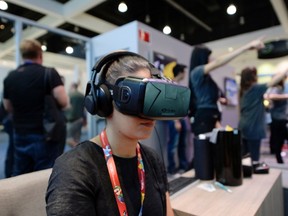 An attendee tries the Oculus VR Inc. Rift Development Kit 2 (DK2) headset at the 2014 Electronic Entertainment Expo in Los Angeles, June 11, 2014.  REUTERS/Kevork Djansezian