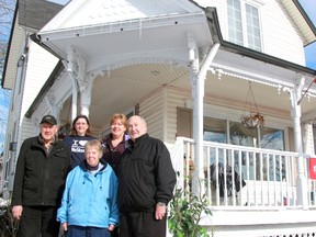 A new bed and breakfast, diner, gift shop and tea room has opened at 156 King St. in Sombra. The century home has been updated and furnished with items from Habitat for Humanity's ReStores. From left are co-owner Bill Piel, Heather Roberts, fund development and community engagement co-ordinator for Habitat for Humanity Sarna-Lambton, Bev Bradley, who's grandmother used to own the home, co-owner Brenda Colombe, and George Bradley. (TERRY BRIDGE/THE OBSERVER)