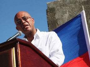 Haiti's President Michel Martelly addresses the audience during a memorial held for the victims of the 2010 earthquake in Titanyen, on the outskirts of Port-au-Prince on Jan. 12. According to some estimates, the 7.0-magnitude earthquake, which struck on January 12, 2010, with an epicentre 25 kilometres (16 miles) west of Port-au-Prince, was the fifth most serious in history, reportedly killing more than 200,000 people, and injuring around 300,000. The memorial was held at Titanyen, the site that was used as a mass burial ground after the earthquake. (Marie Arago/Reuters)
