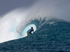 Brazil's Ricardo Dos Santos competes during a heat at the Billabong Pro Tahiti in the southern Pacific ocean island of Tahiti, French Polynesia, on August 26, 2012 in Teahupoo. (AFP PHOTO/GREGORY BOISSY)