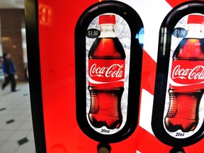 File photo shows a Coca Cola vending machine. AFP PHOTO / Jewel Samad