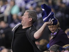 A Toronto Maple Leafs fan throws his jersey on the ice during the third period of the Winnipeg Jets 5-1 win in NHL action at MTS Centre in Winnipeg, Man., on Sat., Jan. 3, 2015. Kevin King/Winnipeg Sun/QMI Agency