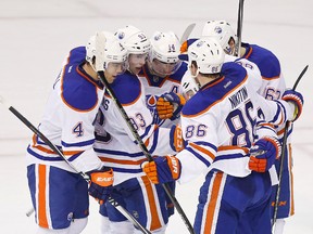 Ryan Nugent-Hopkins celebrates his game-tying goal against the Capitals with teammates during the dying minutes of Tuesday's game in Washington. (USA TODAY SPORTS)