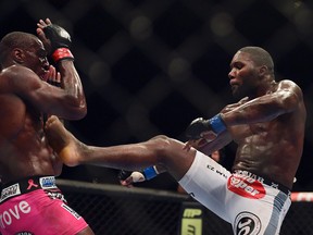 Anthony Johnson (blue gloves) fights Phil Davis during UFC 172 at Baltimore Arena in April.  (Tommy Gilligan/USA TODAY Sports)