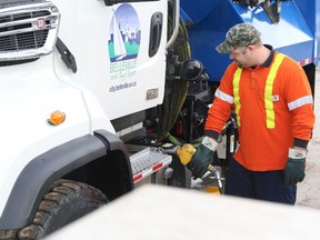 City public works employee Andrew Visser pumps diesel fuel into one of the many trucks in the fleet on Wednesday.  
Jason Miller/The Intelligencer