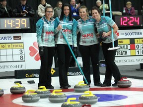 Third Selena Kaatz, Skip Kerri Einarson, Lead Kristin MacCuish and Second Liz Fyfe pose with the eight rocks they counted during their first game of the provincial Scotties Tournament of Hearts in Winkler, Manitoba on January 21, 2015. In what was possibly the first eight-ender in Scotties history, the Kerri Einarson rink beat Dauphin's Tiffany McLean 16-3. (GREG VANDERMEULEN/Winkler Times)