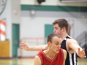 Jayme Ouelette of the Macdonald Cartier senior boys basketball team, pictured in action against the Horizon Aigles on Monday night, is this week's Cambrian College/Sudbury Star High School GameChanger award winner.