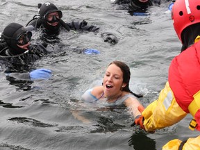 Laura Meggs of Downtown Kingston swims for shore with a look of shock from the icy water at the Polar Bear Plunge in this Whig-Standard file photo. (Whig-Standard file photo)