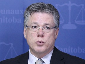 Richard Chartier, chief justice of court of appeals, speaks during a press conference to discuss Access to Justice Initiatives at the Law Courts Building in Winnipeg, Man., on Fri., June 27, 2014.