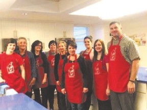 From left to right, Hayden Payne, Gerry Weir, Lori Payne, Cathy Combs, Judy Kalar, Valerie Waite, Jennifer Kraft, Jolin Payne and Ken Payne prepared a meal for families and guests at Ronald McDonald House in London. (Photo supplied)