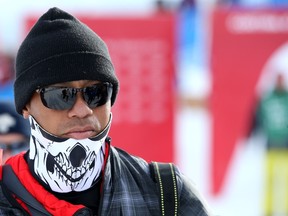 Tiger Woods walks in the finish area during the women’s World Cup Super G event of the FIS Ski World Cup in Italy this week. He lost a tooth at the race, according to his agent. (AFP)