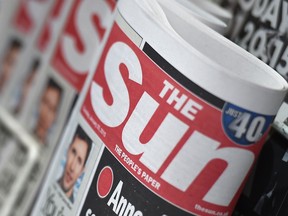 Copies of The Sun newspaper are seen on a newsstand outside a shop in central London Jan. 20, 2015. REUTERS/Toby Melville