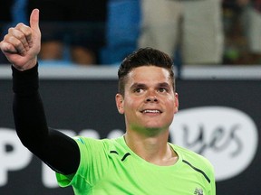 Milos Raonic celebrates after defeating Donald Young of the U.S. in their men's singles second round match at the Australian Open 2015 tennis tournament in Melbourne January 22, 2015. REUTERS/Athit Perawongmetha