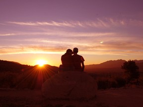 A young couple revels in their "pink moment" on Meditation Mount at sunset in Ojai, Calif. STEVE MacNAULL PHOTO