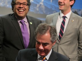 Alberta Premier Jim Prentice (M) jokes with Calgary Mayor Naheed Nenshi (L) and Edmonton Mayor Don Iveson as Prentice signed the Memorandum of Understanding (MOU) that will see a revised Municipal Government Act (MGA) in place in 2016. The three were at the McDougall Centre in downtown Calgary, Alta. on Thursday January 22, 2015.

Stuart Dryden | Calgary Sun | QMI Agency