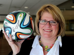 Shannon Claggett in Kingston with a FIFA soccer ball she received at the FIFA Balloon d'Or awards ceremony in Zurich, Switzerland. She was selected to represent Canadian volunteers for the Fair Play award. (Ian MacAlpine/The Whig-Standard)