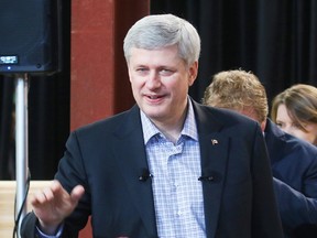 Prime Minister Stephen Harper paid a visit to Framecraft on First St. Louth in St. Catharines and announced new regulations and funding for small businesses on Thursday, January 22, 2015. Julie Jocsak/ St. Catharines Standard/QMI Agency