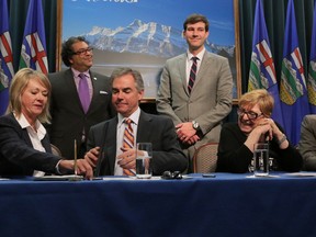Calgary Mayor Nahhed Nenshi (back left) and Edmonton Mayor Don Iverson (back right) watch as (from l to r) Municipal Affairs Minister Diana McQueen,  Alberta Premier Jim Prentice, Alberta Urban Municipalities Association's President Helen Rice and Alberta Association of Municipal Districts and Counties President Al Kemmere signed the Memorandum of Understanding (MOU) that will see a revised Municipal Government Act (MGA) in place in 2016 at the McDougall Centre in downtown Calgary, Alta. on Thursday January 22, 2015. Stuart Dryden/Calgary Sun/QMI Agency