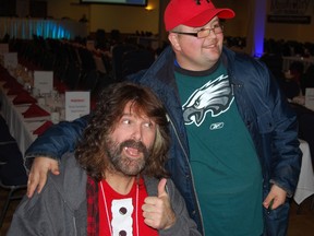 Professional wrestling legend Mick Foley, left, poses with Special Olympics Athlete of the Year Peter Martens of Aylmer at the St. Thomas Sports Spectacular Thursday at the St. Anne's Centre. The event saw many legendary athletes and coaches meeting with fans and media, with a dinner to follow. Proceeds from the event go to Special Olympics and Community Living Elgin.

Ben Forrest/Times-Journal