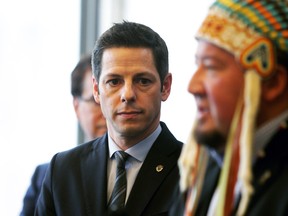 Winnipeg mayor Brian Bowman listens to Derek Nepinak, Grand Chief of the Assembly of Manitoba Chiefs, at a press conference at City Hall in Winnipeg, Jan. 22, 2015. (CHRIS PROCAYLO/QMI Agency)
