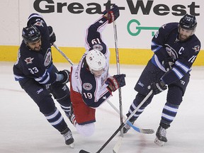 Jets defenceman Dustin Byfuglien (left) will play in the all-star game this weekend, but does he really even want to be there?