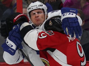 Maple Leafs captain Dion Phaneuf gets into it with Ottawa Senators' Milan Michalek on Wednesday night, during the last set of games ahead of the all-star break. (Tony Caldwell/Ottawa Sun)