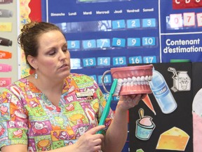 Tennille Needham, a dental hygienist from Spruce Grove, showed 150 Grade 1 and 2 students at École Meridian Heights School in Stony Plain how to properly brush their chompers on Jan. 15. The dental presentation was one of many Needham will make this year. Needham expects to speak to roughly 1,700 students in the Capital Region about proper oral health by the end of the school year. - Karen Haynes, Reporter/Examiner