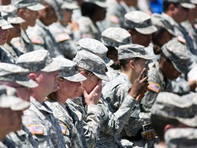 A soldier gets emotional during U.S. president Barack Obama's remarks at a memorial service in Fort Hood in Killeen, Texas April 9, 2014. (JULIA ROBINSON/Reuters)