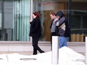 Emily Mountney-Lessard/The Intelligencer
Rebecca Forbes and Michael McInnis (grey shirt) exit the Quinte Courthouse Friday after entering guilty pleas to theft and fraud charges part way through their trial. The pair had originally pleaded not guilty to their charges Monday morning.