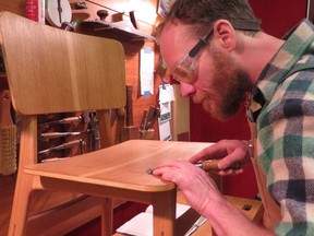 At Ficus Studios, Brad Goertz puts the finishing touches on a hand-crafted chair. (SUPPLIED)