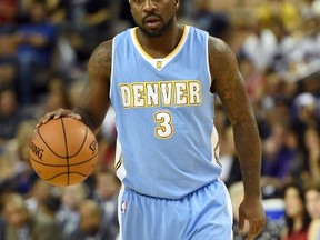 Ty Lawson of the Denver Nuggets brings the ball up the court against the Los Angeles Clippers during their preseason game at the Mandalay Bay Events Center on October 18, 2014. (Ethan Miller/Getty Images/AFP)