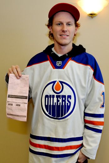 Oilers fan throws jersey best sale on ice