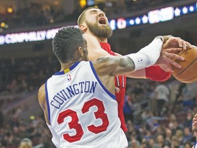 Raptors centre Jonas Valanciunas is fouled during Friday night's game against the Philadelphia 76ers. (USA TODAY SPORTS)