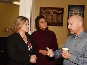 Ontario NDP leader Andrea Horwath, local candidate Suzanne Shawbonquit and Darren Stinson of the Copper Cliff curling club discuss hydro rates on Friday morning. (Mary Katherine Keown/The Sudbury Star)