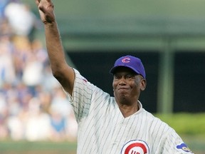Chicago Cubs great Ernie Banks throws out the ceremonial first pitch before Game 3 of the MLB National League Division Series playoff baseball game against the Philadelphia Phillies in Chicago, in this file picture taken October 6, 2007. REUTERS/Frank Polich/Files