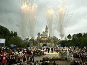 Fireworks fill the sky as Mickey Mouse and other Disney characters fill the stage during the finale at Disneyland's 50th anniversary celebration ceremony at the Disneyland theme park, as "The Happiest Homecoming on Earth" begins in Anaheim, California in this May 5, 2005 file photo. REUTERS/Fred Prouser/Files
