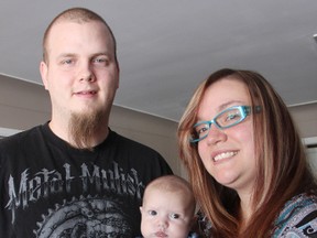 Devon Davidson and Amber Oakes stand with their infant son Hudsyn Davidson. A benefit is being held for the Sarnia family Feb. 15 to help finance trips to Toronto for surgeries to fix several heart defects Hudsyn Davidson was born with. TYLER KULA/ THE OBSERVER/ QMI AGENCY