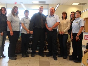 The Goderich LCBO was involved with the “Giving It Back In Our Community” fundraising drive in December. They raised $10,200, more than double the amount from 2013. Pictured (left to right) are Goderich LCBO staff Jennifer Burt, Marianne Snieder, Janice Gregory, manager Rodger Donald, Peter Robb, Cara Hoogenboom, Karen McCallum and Wendy Crittenden. (Dave Flaherty/Goderich Signal Star)