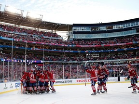 Washington Capitals players celebrate after defeating the Chicago Blackhawks in the 2015 Winter Classic at Nationals Park. (Geoff Burke/USA TODAY Sports)