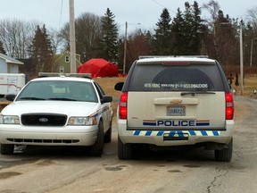 RCMP vehicles block access to cottages in Grand Desert, N.S. near Halifax on Thursday Jan. 21, 2015. Police are still at one of the three homes they raided Tuesday, where they said they've found "large quantities of chemicals" at a cottage in Grand Desert, 40 km east of Halifax. Kris Sims/QMI Agency