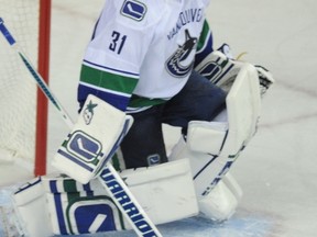 The Vancouver Canucks don’t Lack for goaltending depth behind No. 1 starter Ryan Miller. Backup Eddie Lack (pictured) or Jacob Markstrom (who is playing in Utica of the AHL) could be used as part of a trade, according to columnist Bruce Garrioch. (STUART DRYDEN/QMI Agency files)